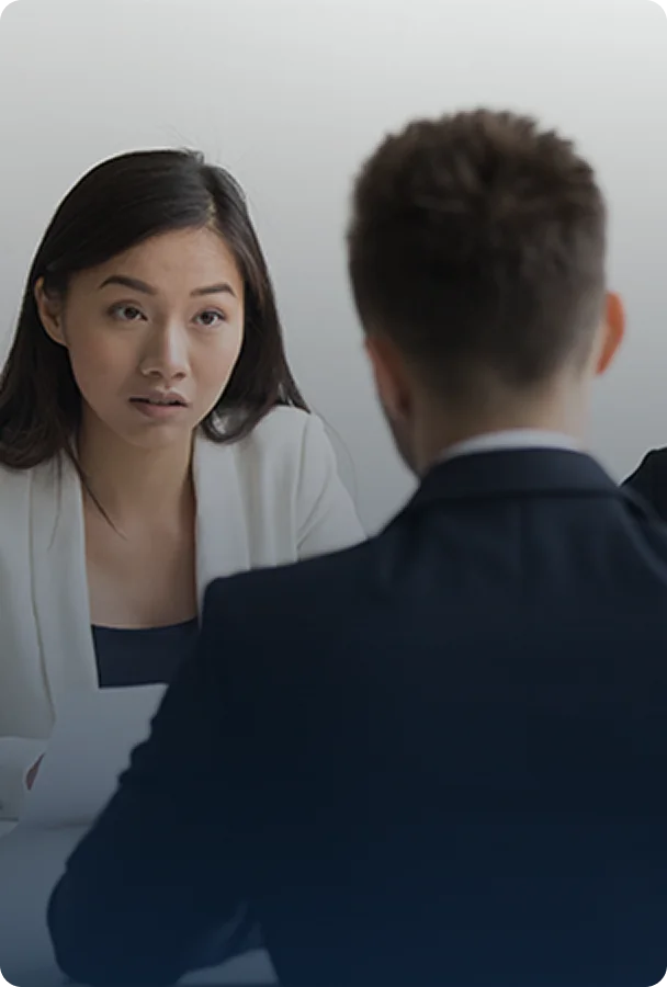 a man and woman in business attire engage in conversation